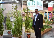 Ralf Schräder of Volz Horticulture next to their new tomato plants for the garden. “It’s the first resistant tomato variety for the garden. One can grow then without a roof. They can get rain and can grow up to 3 meters.”